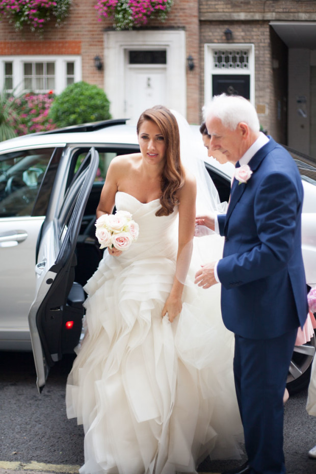 gorgeous london bride arrives with a car at her church in mayfair in a vera wang wedding dress