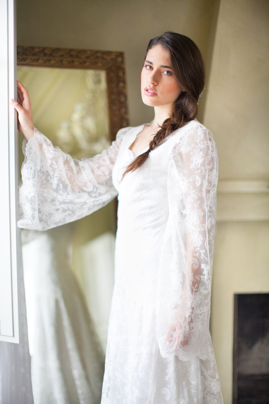 fine art bridal portrait of an italian bride with a braid in a rustic suite in italy