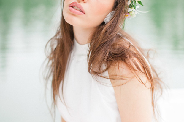 close up of the lips of a rustic bride on a small boat on a lake in italy