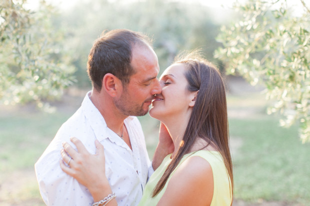 soft kiss during an engagement session of an italian couple among the olive trees in chieuti apulia italy