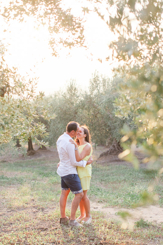 engagement session with an italian couple in back light in apulia, southern italy among the olive trees
