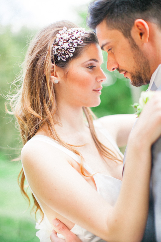 a romantic moment of a bride and groom hugging during their wedding portraits in italy