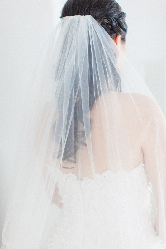 a fine art portrait of a bride's gorgeous veil while she's getting ready for her destination wedding in santorini greece